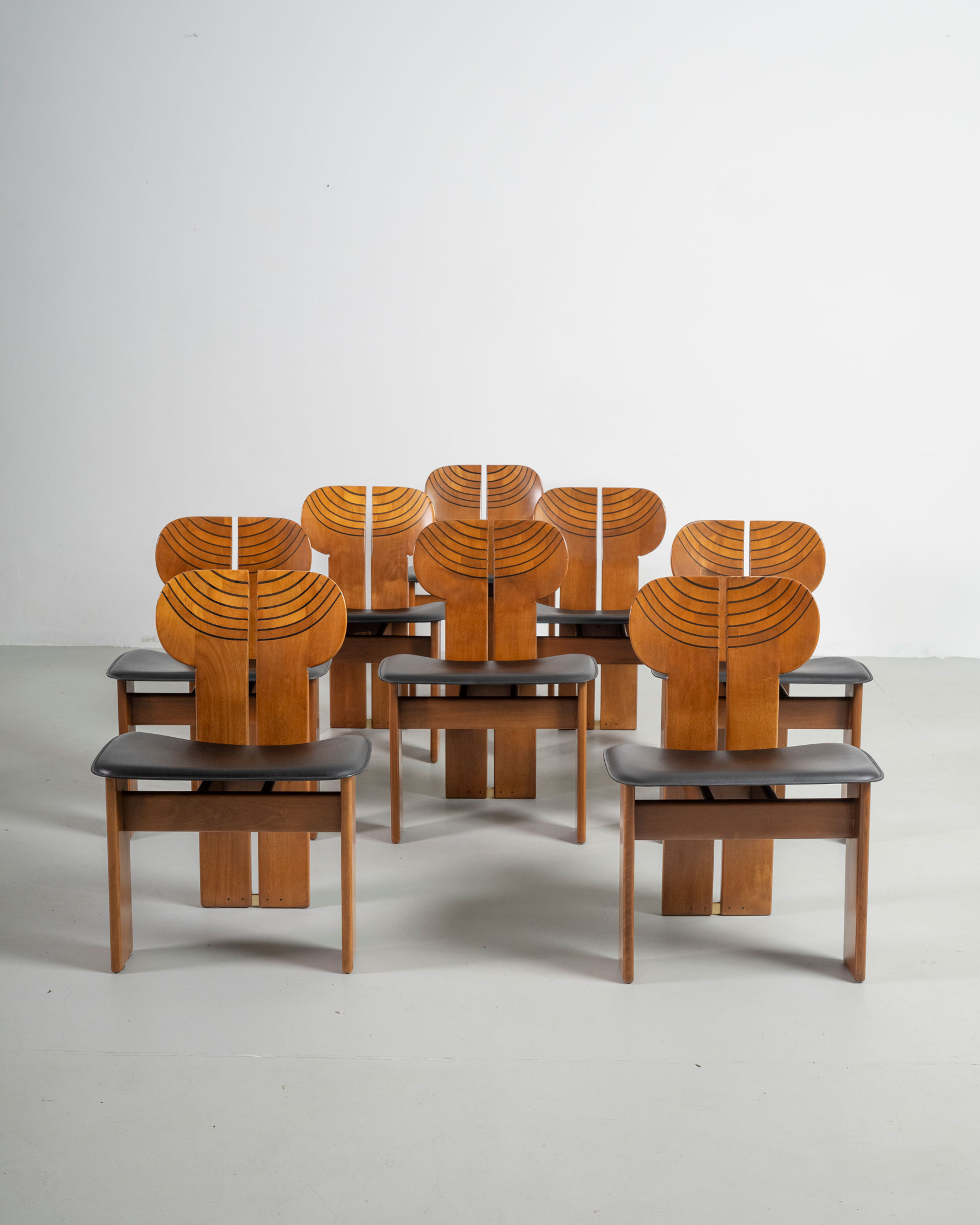 A set of eight Africa chairs
